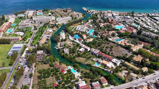 Aerial view of Moraitika and Messonghi resort villages with river and Ionian sea coast in Corfu island, Greece summer.