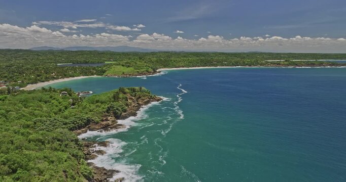 Kudawella Sri Lanka Aerial v2 cinematic drone fly around rocky shore capturing Hummanaya blow hole, sandy beach, bay harbor and Indian oceanscape in exotic summer - Shot with Mavic 3 Cine - April 2023