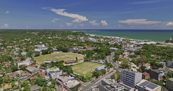 Matara Sri Lanka Aerial v7 panoramic flyover town center capturing Uyanwatta stadium, colonial townscape, Nilwala river, coastal fort and Nupe neighborhood views - Shot with Mavic 3 Cine - April 2023
