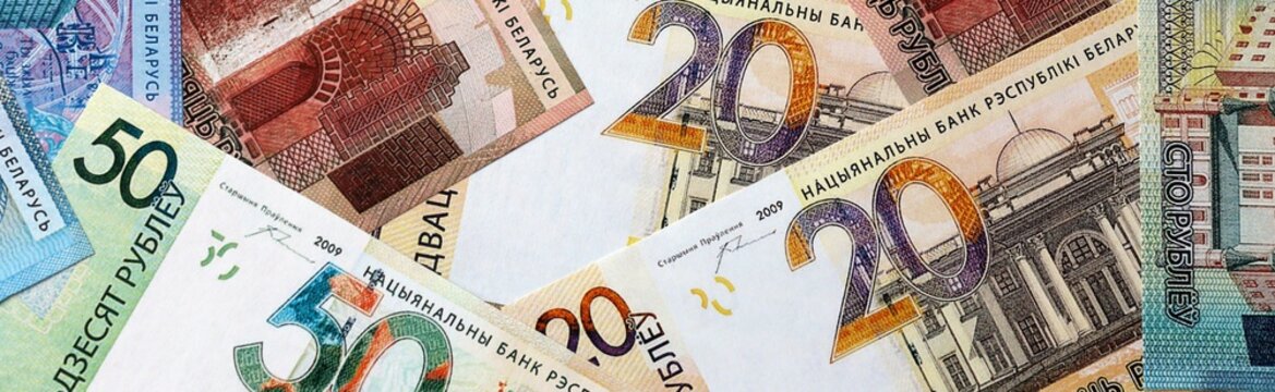 Belarusian ruble money bills in pile on table. Belarus BYN currency cash close up