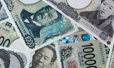 Japanese yen money bills in pile on table. Japan JPY currency cash close up © Viktor