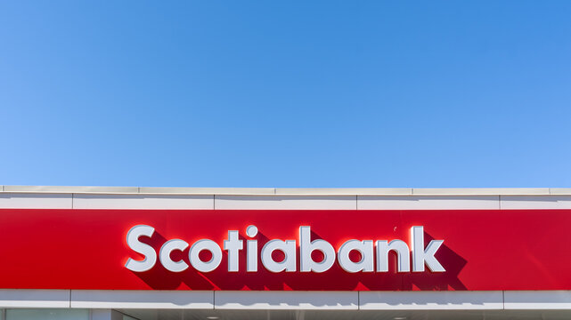 Oshawa, Ontario, Canada - September 26, 2026: A red exterior sign and logo of a Scotiabank branch on the building against a clear blue sky. Oshawa, Ontario, Canada. 