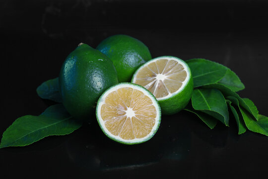 lime and lemon on a dark background