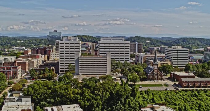 Knoxville Tennessee Aerial v1 forward moving drone shot across urban areas toward river, capturing downtown cityscape during the day - Shot with Inspire 2, X7 camera - August 2020