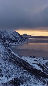 Aerial view of a norwegian fjord during winter sunset