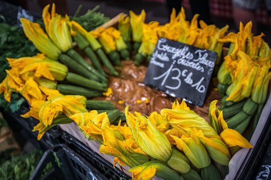 Courgette or zucchini flowers at a provencal farmers market in the old town of Antibes, France