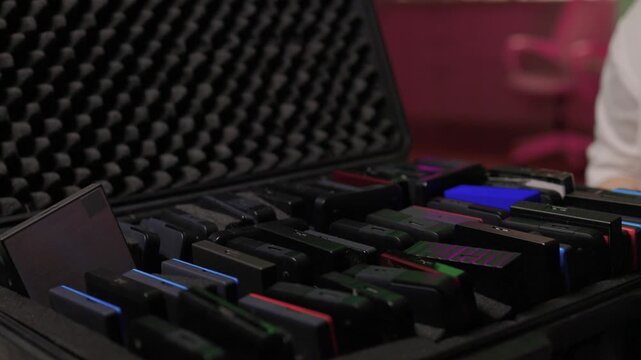 Closeup of external hard drive being connected to desktop computer. Modern workspace setting with data migration between external hard drive and desktop computer