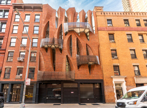 New York, NY - US - Sep 25, 2026 : 187 Franklin Street in Tribeca features a sculptural red-brick facade, angled windows and perforated metal balconies designed by SYSTEMarchitects in Manhattan, NYC .