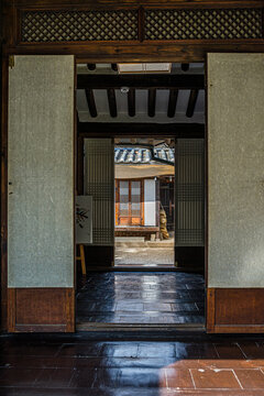 SEOUL, SOUTH KOREA &ndash; SEPTEMBER 27, 2026: Traditional Hanok interior overlooking the courtyard through wooden doors at Bukchon Culture Center in Seoul.