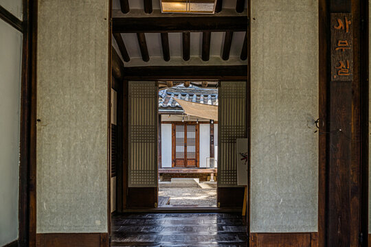 SEOUL, SOUTH KOREA &ndash; SEPTEMBER 27, 2026: Traditional Hanok interior overlooking the courtyard through wooden doors at Bukchon Culture Center in Seoul.