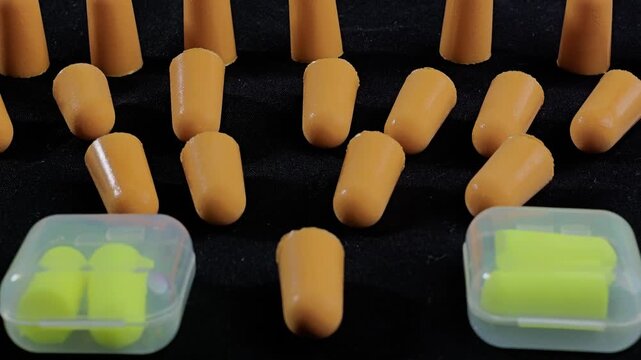 A pile of noise cancelling earplugs placed together.