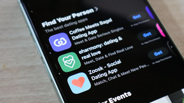 Smartphone screen showing diverse dating apps including eharmony and coffee meets bagel.