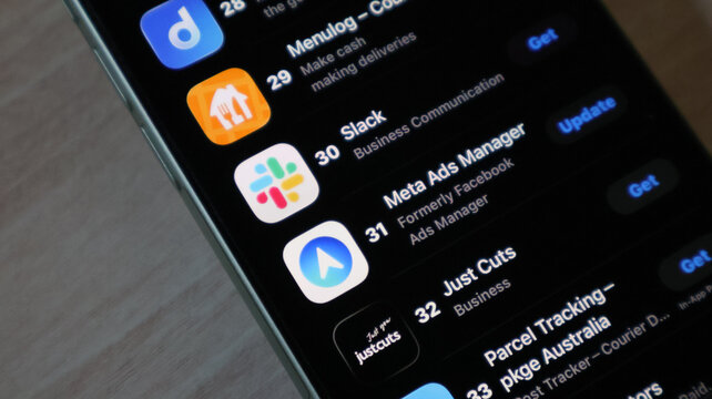 Close up of slack and meta ads manager apps on smartphone screen list.