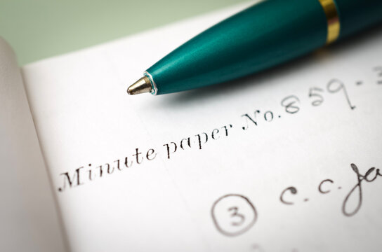 Official Minute Paper with Pen Illustrating Meeting Documentation and Record Keeping