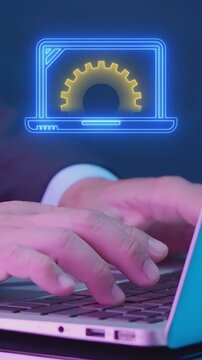 Businessman hands typing laptop keyboard vertical shot with glowing floating screen displaying gear. Executive corporate office work productivity, business management workflow, and system concept.