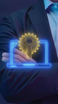 Businessman crossed arms vertical shot with glowing laptop displaying technical service gear wrench. Corporate IT maintenance support, hardware system troubleshooting, and repair solution concept.