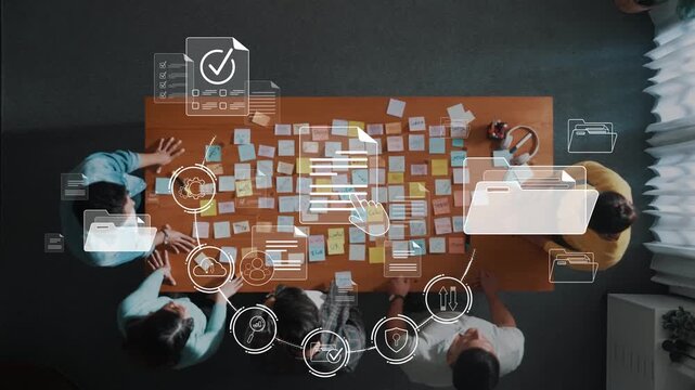 A diverse team engages in a brainstorming session, using sticky notes on a table, supported by digital icons representing project management and collaboration tools for effective teamwork. Raster