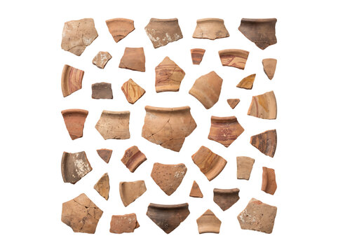Scattered fragments of ancient pottery shards with varied textures and colors on black background de isolated on a transparent background