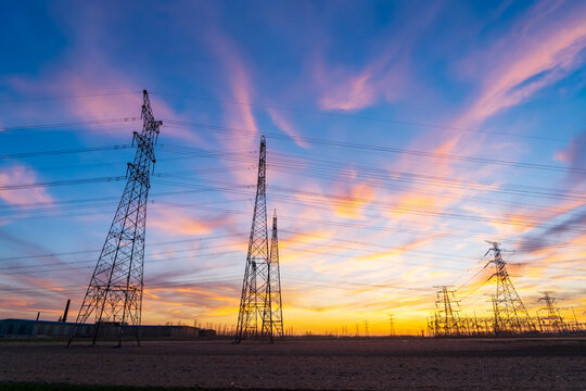 The pylons are in the evening, Substation in the evening, High voltage substation and beautiful sunset glow
