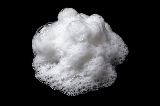 White soap foam isolated on black background