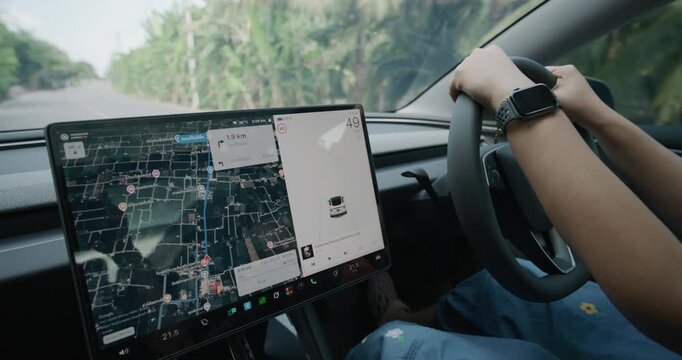 Women drive EV car use navigator GPS travel in nature village transport technology