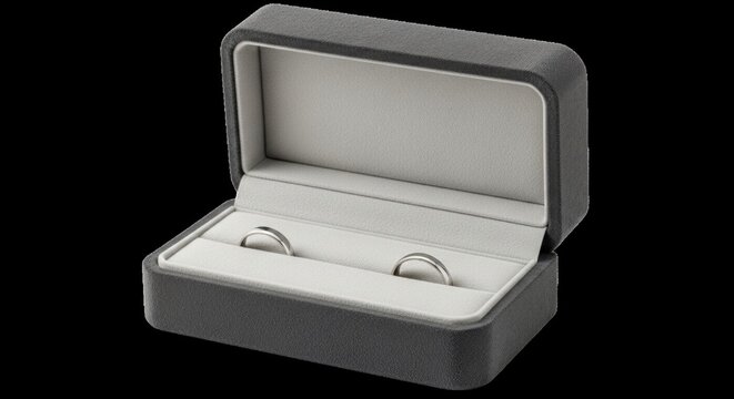 Elegant gray velvet ring box displaying two simple silver wedding bands, symbolizing love and commitment