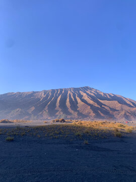Volcanic mountain ridge under blue sky
