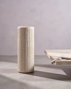 Minimalist Textured Cylindrical Ceramic Vase Standing on Concrete Surface for Modern Interior Decor and Still Life Photography