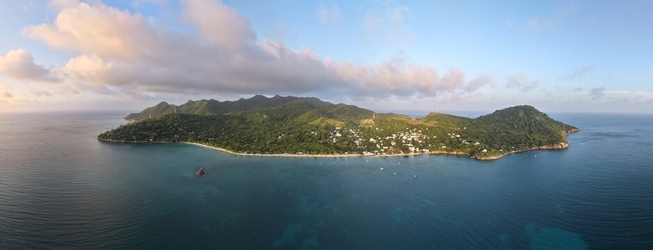Panoramic Aerial View of Providencia Island Surrounded by Deep Blue Caribbean Sea Waters and Warm Sunset Light, San Andres Archipelago, Colombia Travel Destination Microstock Photography Background