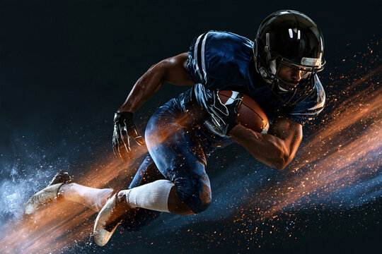 Football player leaps forward with fierce determination. His body leans low, muscles tense, eyes locked ahead. Dust and sparks swirl behind him, emphasizing speed and power