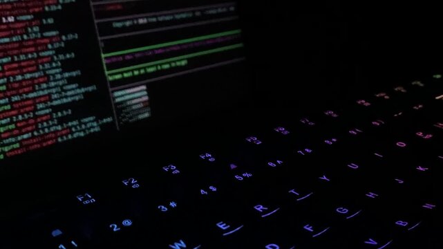 Coding Script Running on Glowing Keyboard&mdash;Ideal for Technology and Software Development Concept