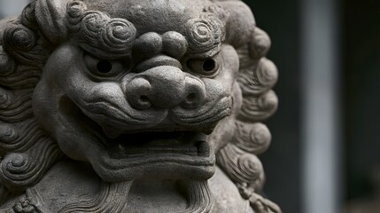 Fototapeta premium Close up of a traditional Chinese stone lion statue with detailed facial carving and textured fur patterns