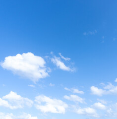 Fototapeta premium Low angle view and full frame of beautiful blue sky with strange shape of thin fluffy white clouds in the afternoon on sunny day used as natural background texture in decorative art work