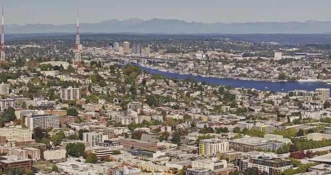 Seattle Washington Aerial v148 zoomed 3x flyover over Belltown and Queen Anne toward Lake Union, University District and Cascade Mountains - Shot with 5k Camera - Oct 6th 2023