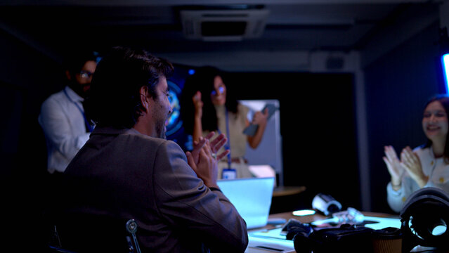 Technology professionals presenting digital analytics and software interface during corporate strategy meeting