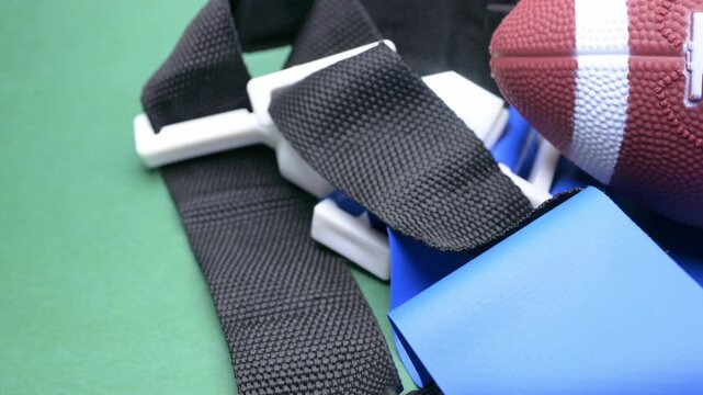 pan view football with flag football belt accessories at horizontal composition