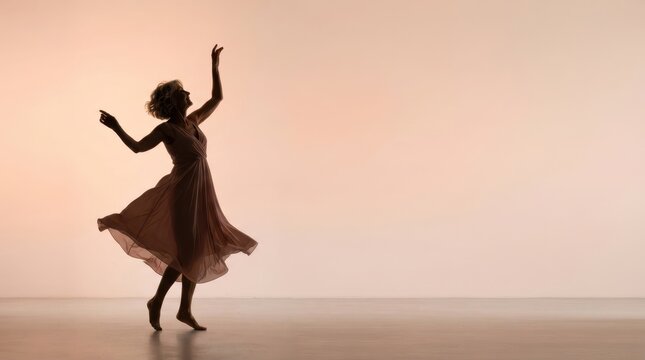 Silhouette dancer on stage: A solitary female dancer, captured in silhouette, elegantly spins on a polished floor, her flowing dress creating a graceful swirl against a soft, warm backdrop.