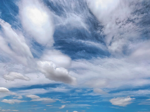 Dramatic White Clouds Across Deep Blue Summer Sky