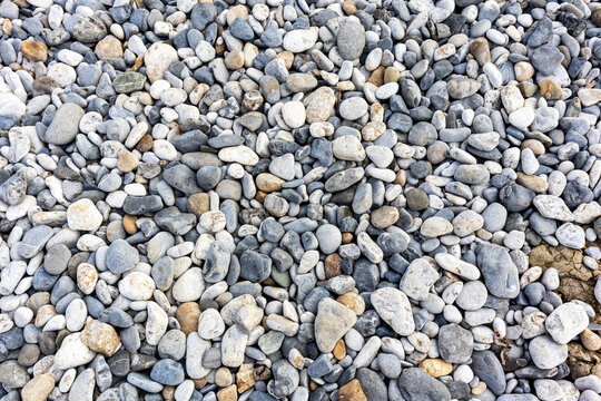 Smooth rounded pebbles covering a stony coastal shingle beach