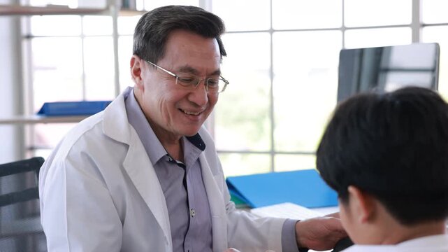 doctor consulting, Mature asian physician psychiatrist consulting concerned with teenage girl, child patient. Children healthcare, check up medical