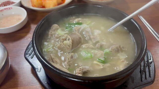 Delicious and steaming hot Korean blood sausage soup Sundae-guk boiling in a pot