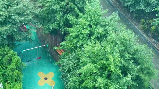 Rainy summer landscape during monsoon season with falling raindrops