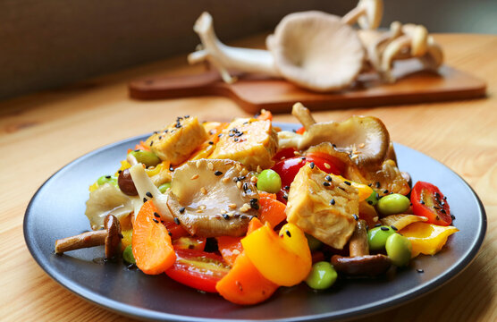 Plate of Delicious Vegetable Salad with Roasted Tempeh Cubes and Mushrooms