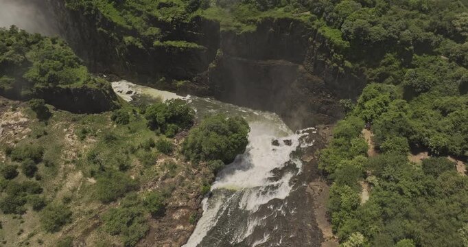 Victoria Falls Zimbabwe Aerial v19 slowmo birds eye veiw flyover cliffside gorge capturing Zambezi river, Cataract island, waterfall and misty landscape - Shot with 5k Camera - Jan 3rd 2024