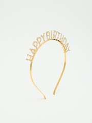 Gold Rhinestone Happy Birthday Headband Tiara Isolated on White Background    © Radik