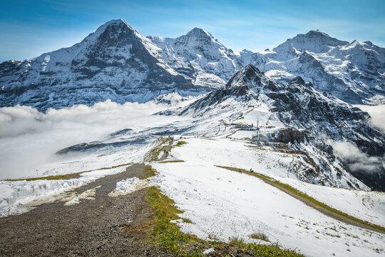 Famous snowy mountain peaks over misty valleys, Lauterbrunnen, Switzerland