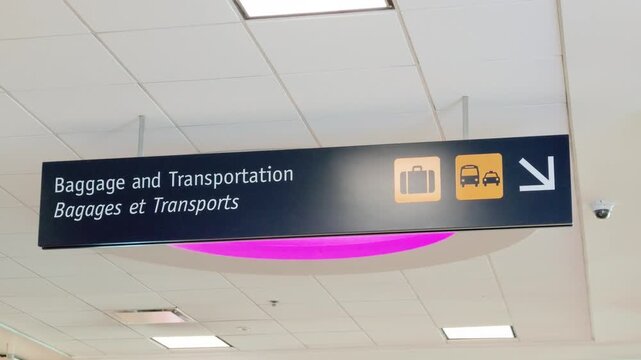 Richmond, British Columbia, Canada - September 26, 2026: Bilingual directional signage inside Vancouver International Airport YVR