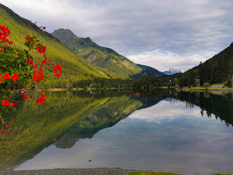 Beautiful view of Champex lake in Valais Switzerland with mountain reflection on calm water