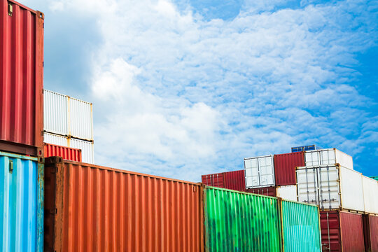 Cargo ship container goods export import international transport on blue sky background, warehouse industry business logistics transportation harbor port industrial shipping terminal cargo ship.