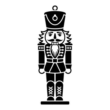 Traditional nutcracker soldier stands in black silhouette